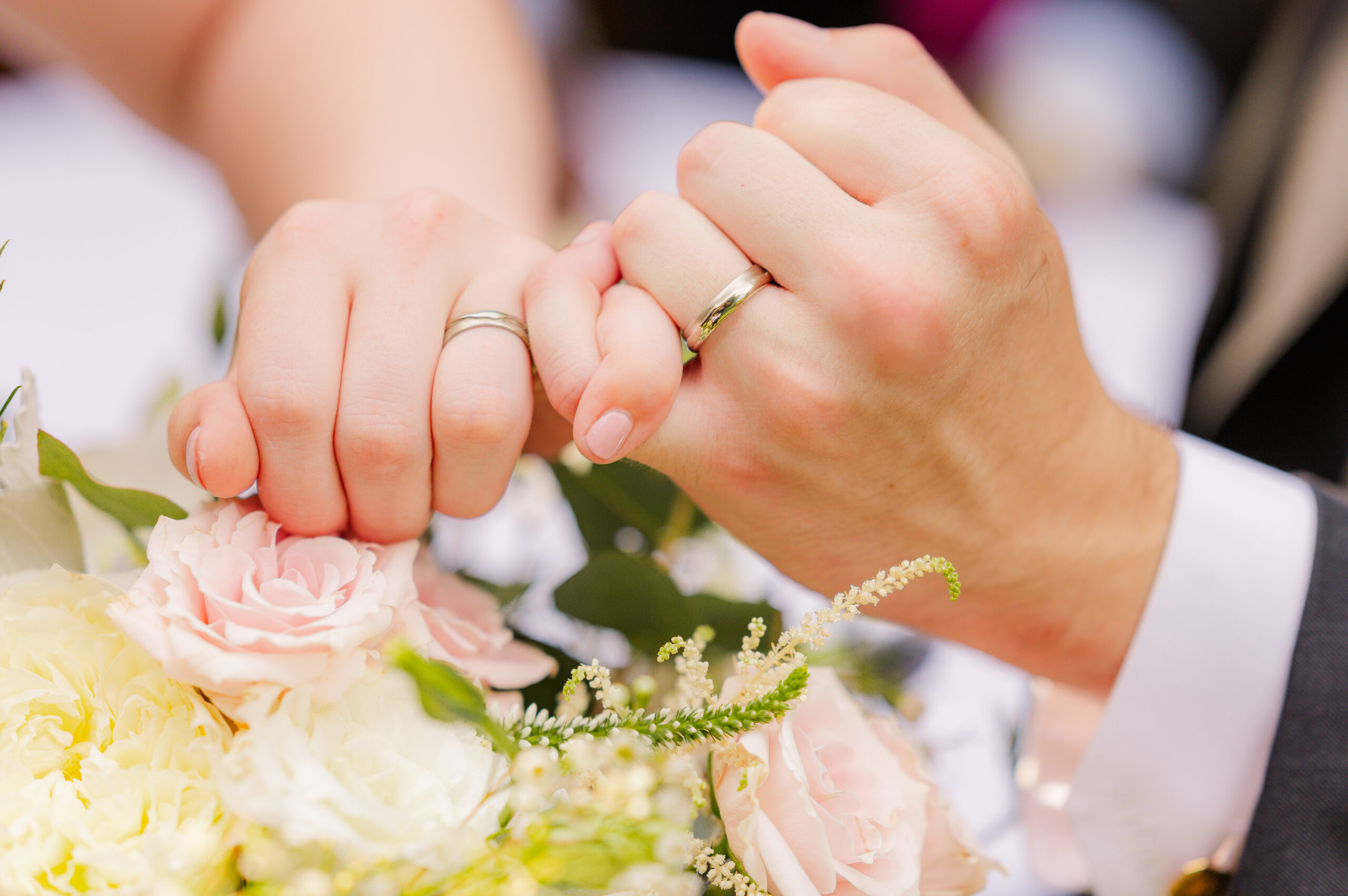 TM Grey Events TM Grey Photo & Events portrait of a married couples hands.